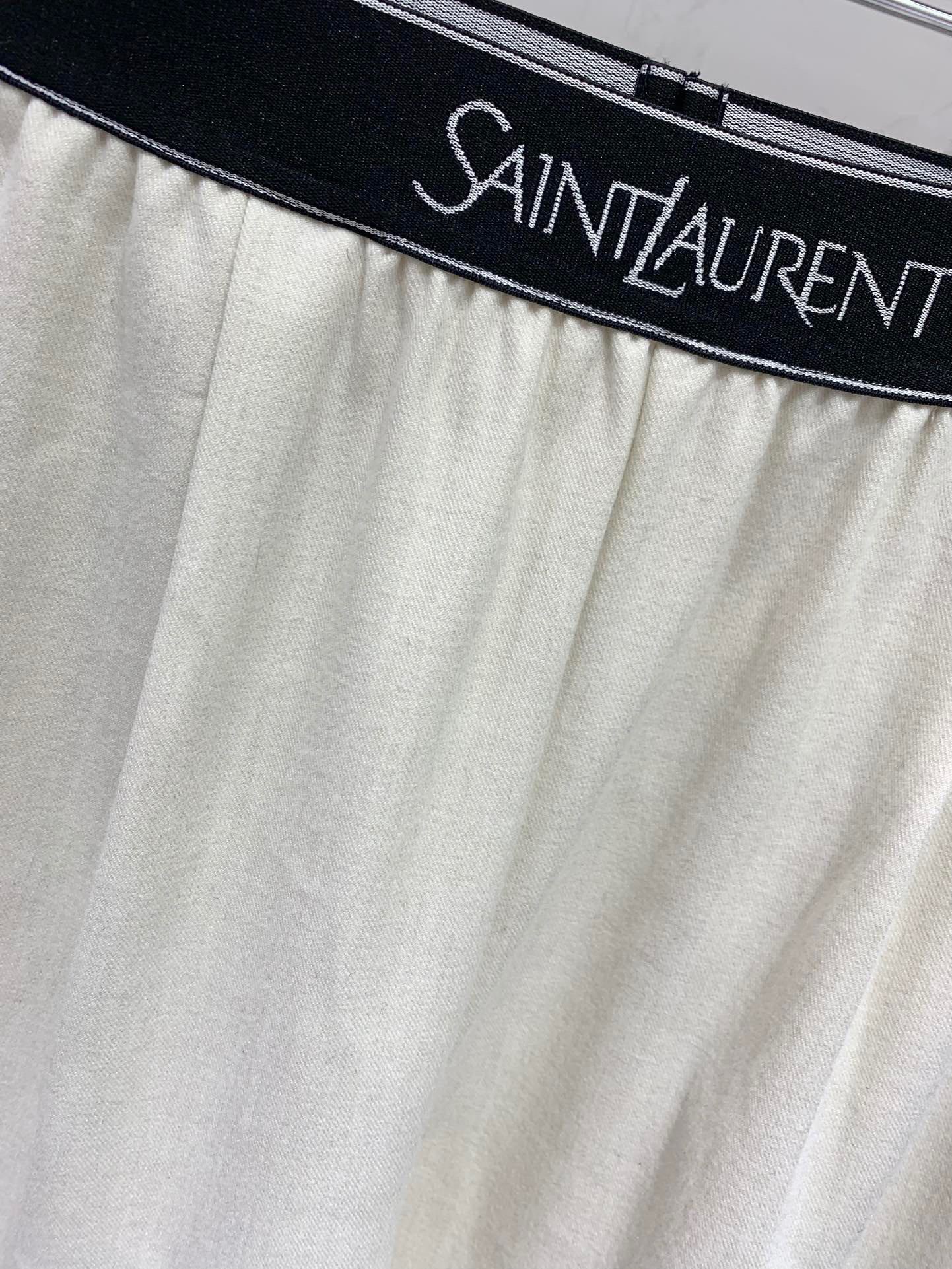 Брюки женские в стиле Saint Laurent молочного цвета с логотипом на поясе