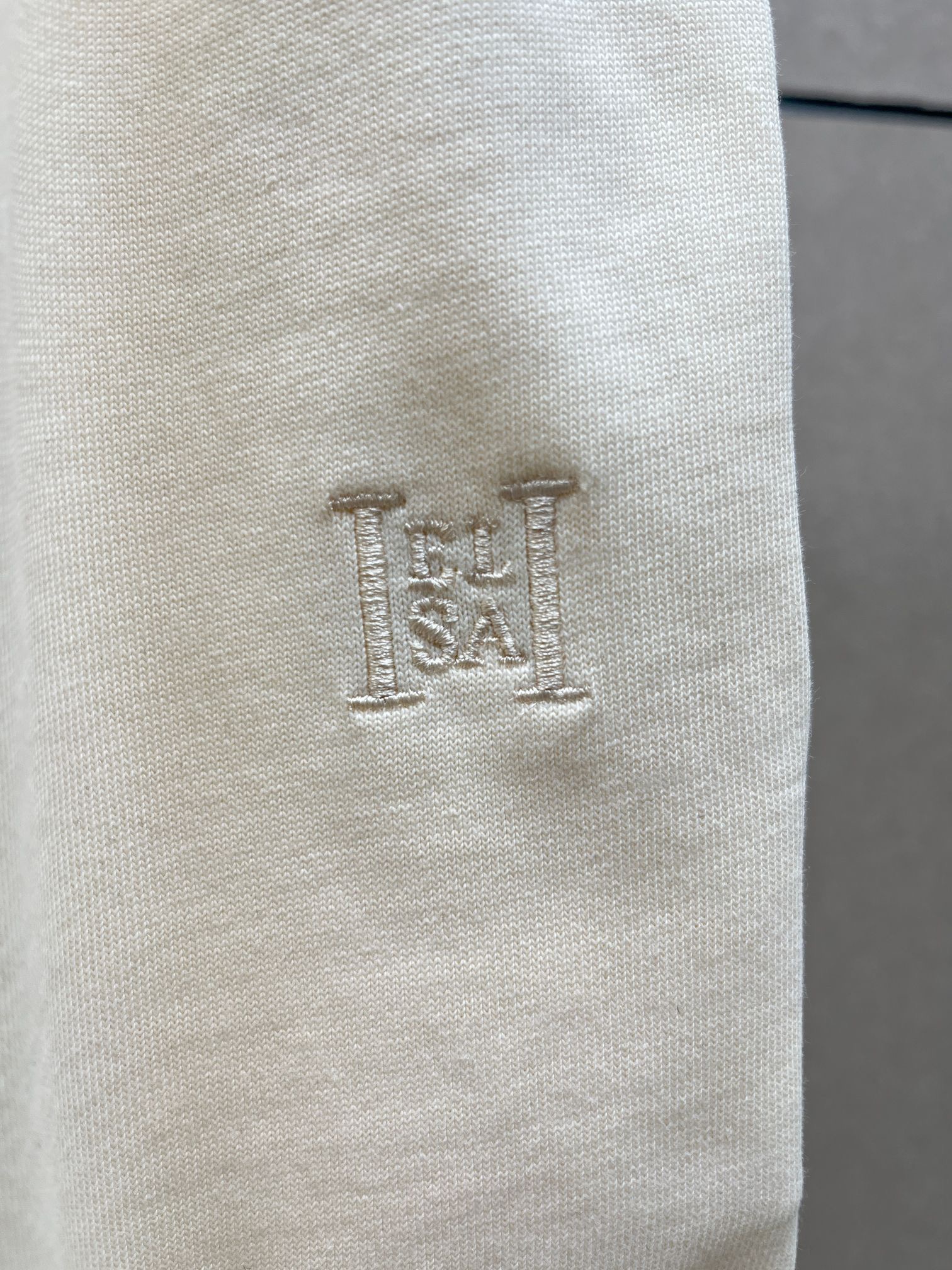 Брюки женские в стиле Toteme молочного цвета с вышивкой