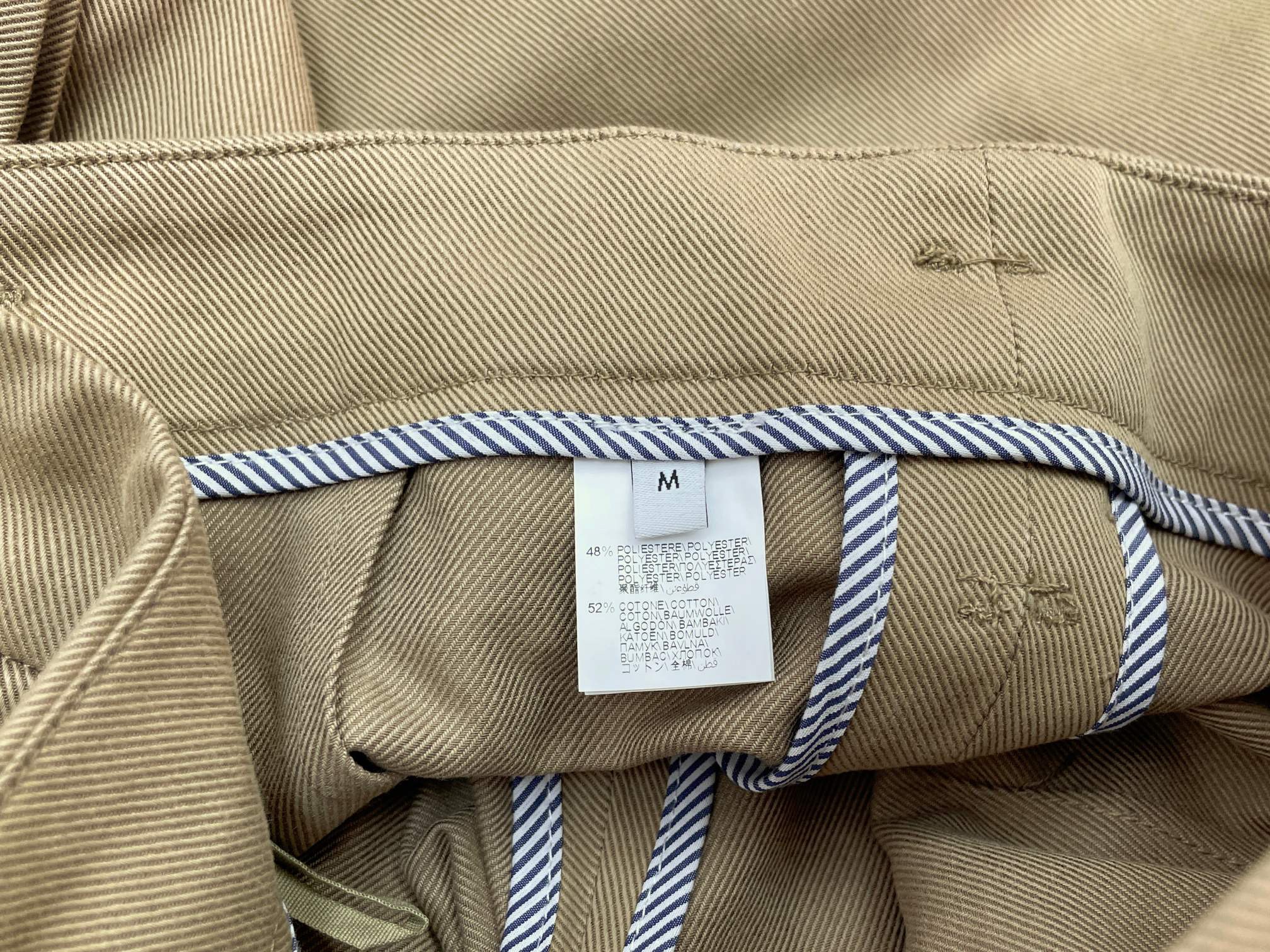 Брюки женские в стиле Brunello Cucinelli из смесовой ткани бежевого цвета с защипами