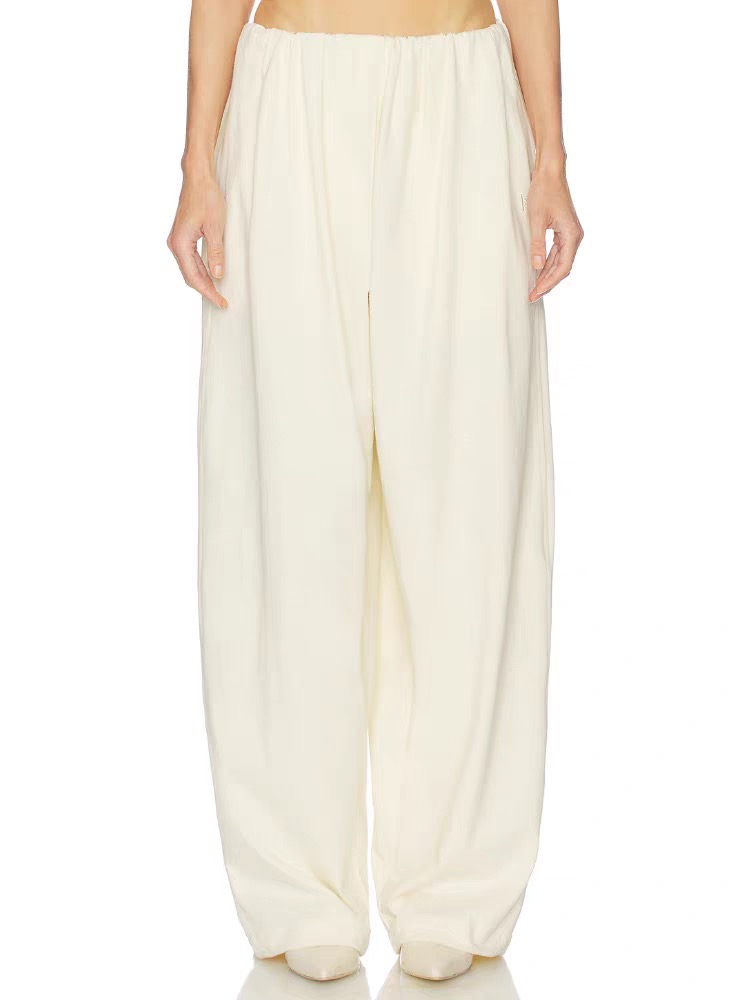 Брюки женские в стиле Toteme молочного цвета с вышивкой