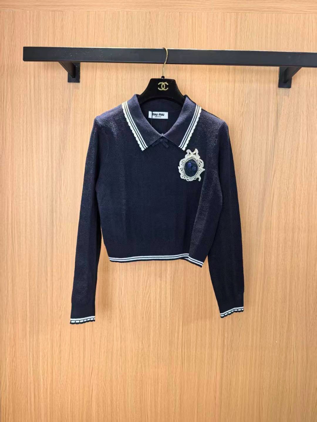 Джемпер-поло женское Miu Miu коричневого цвета