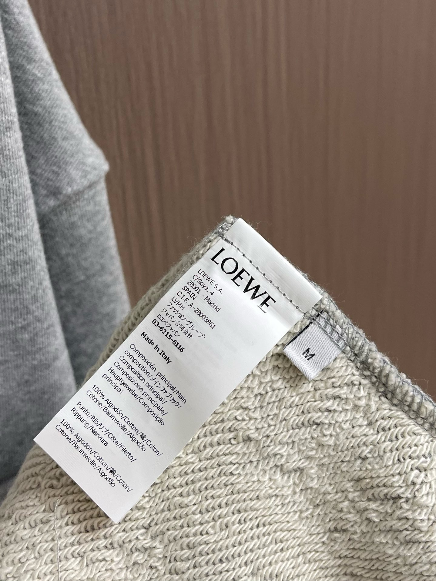 Худи Loewe светло-серого цвета с кожаными шнурами и вышивкой Anagram