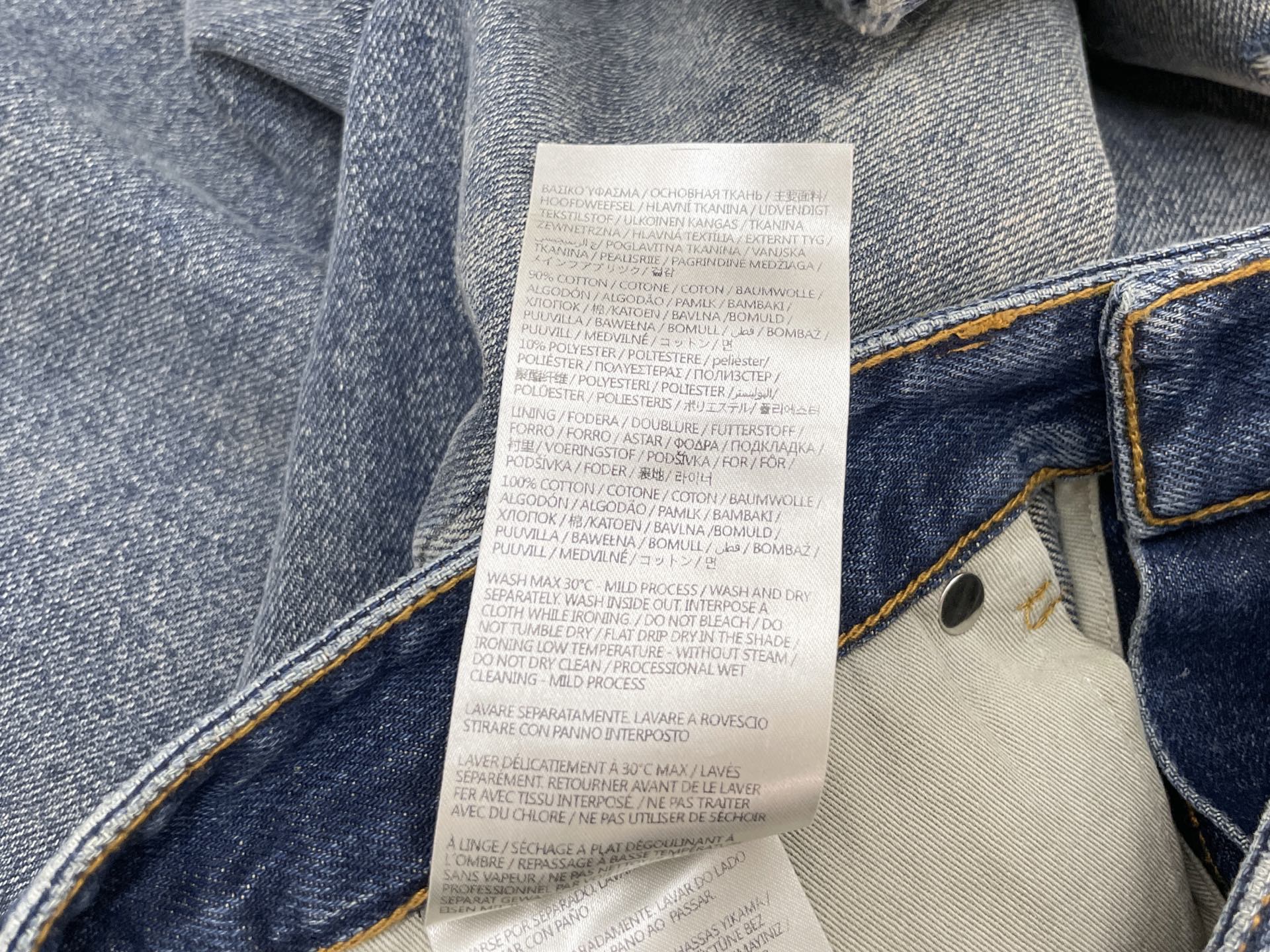 Джинсы женские в стиле Maison Margiela синего цвета широкие с эффектом потертости